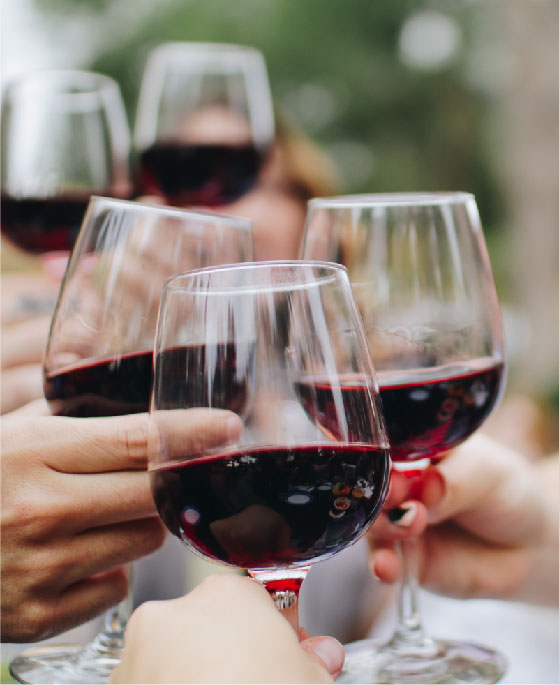 red wine glasses cheering